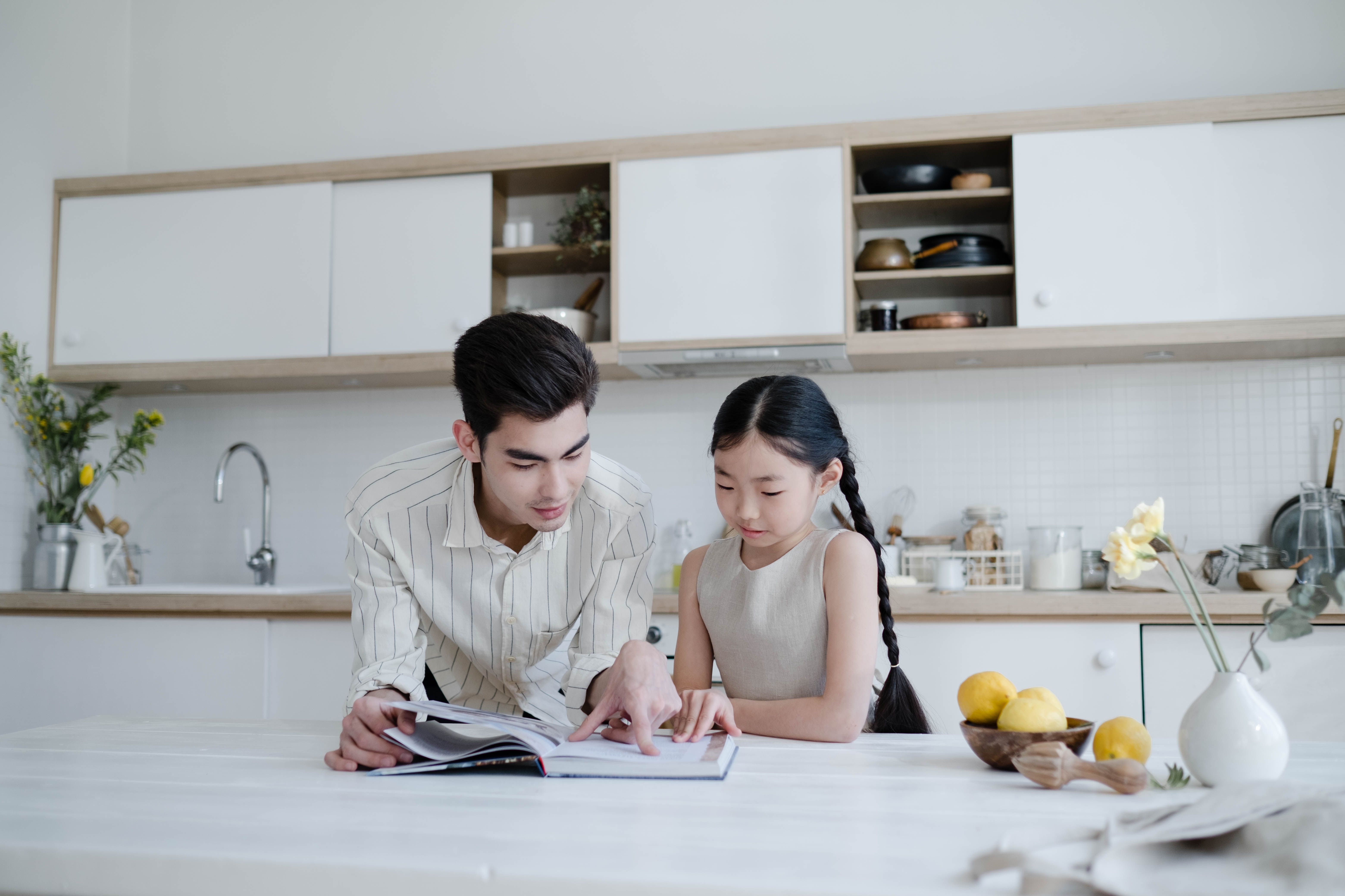 father and daughter reading