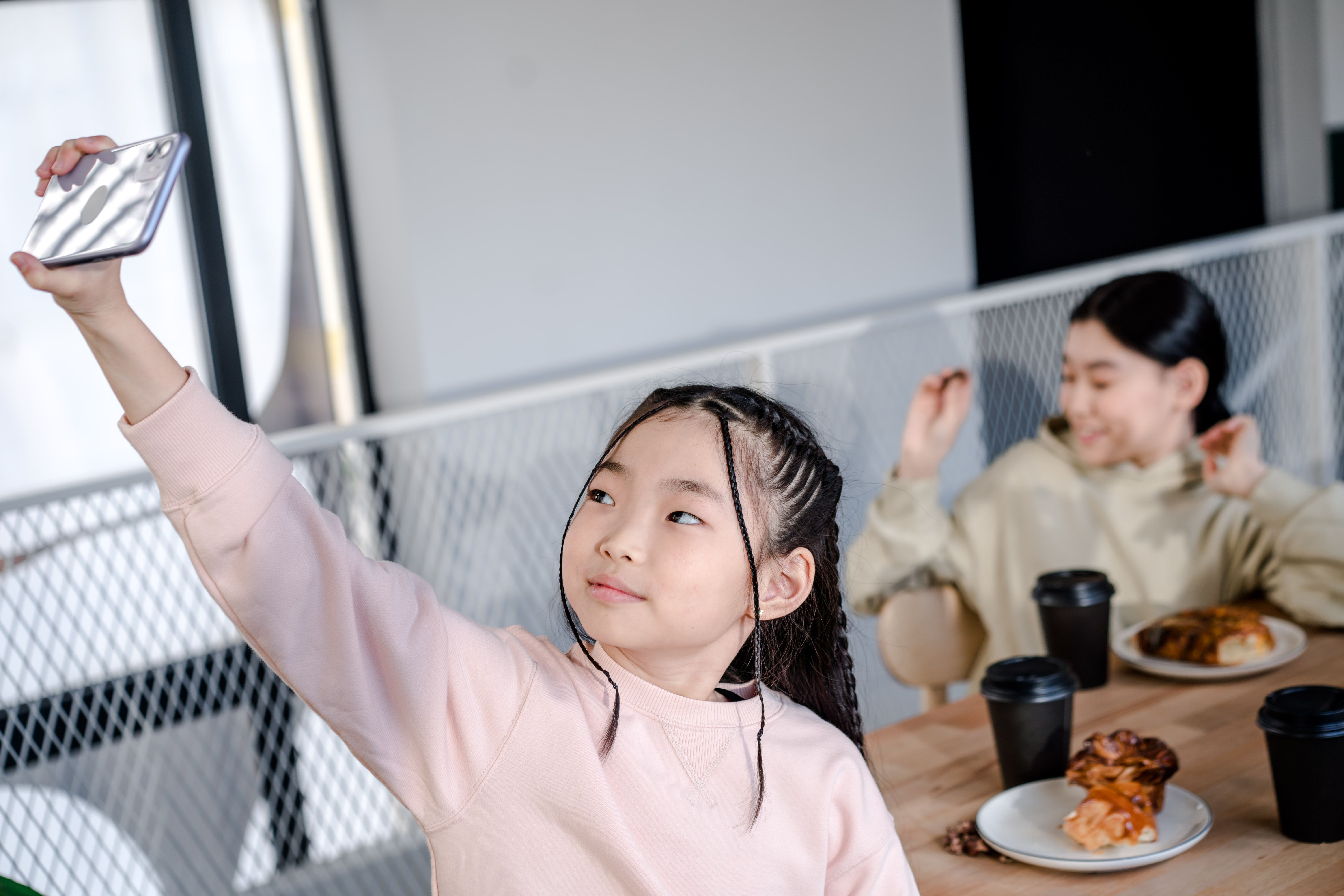 A teenager using a phone during the school holidays